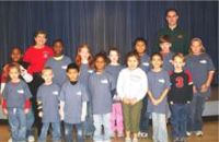 Principal,Mary Beth Dennis, & Bailey's TaeKwonDo Northport instructor, Michael Holt are pictured with students that received the "Integrity Leadership Award"
