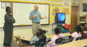 Karen Thompson of Temporary Emergency Services and Rusty Smith of United Way talk with students about career awareness