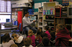 An employee from the Vulcan Materials Plant in Birmingham reads to a 3rd grade class at Vance