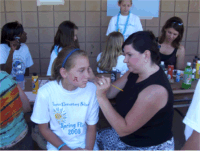 Verner Elementary students get face painting designs from Bank of Tuscaloosa Kimberly Tucker